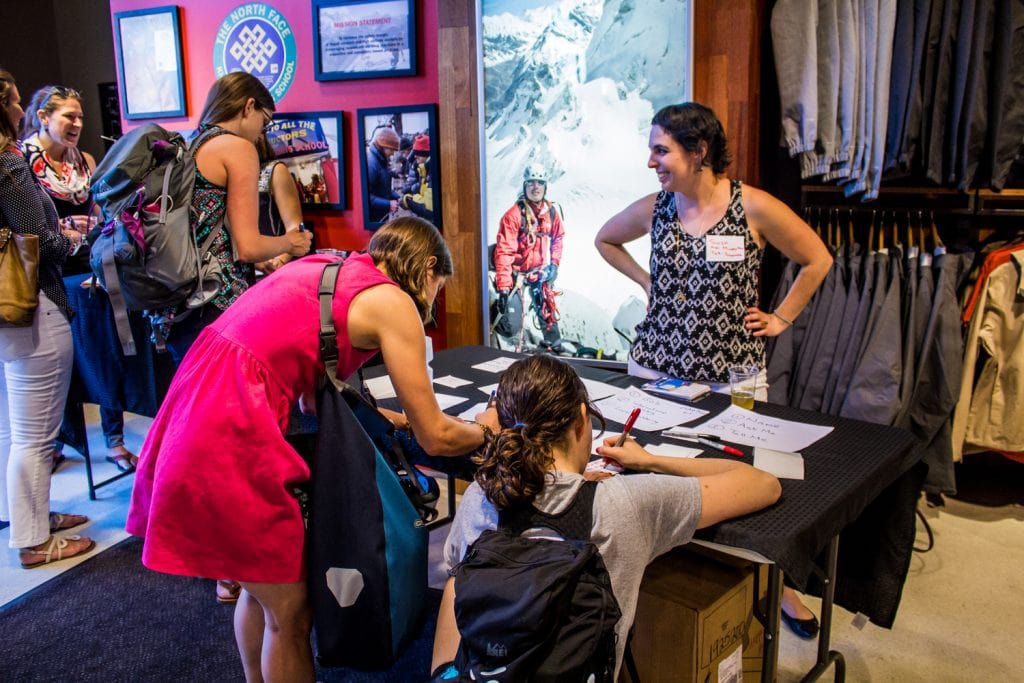 Mappy Hour Leader Suza checks people in at The North Face Georgetown.