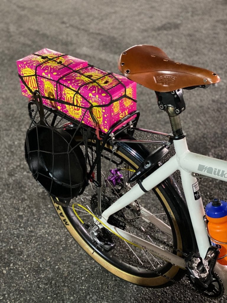 Two six packs of Sierra Nevada attached to a bike rack
